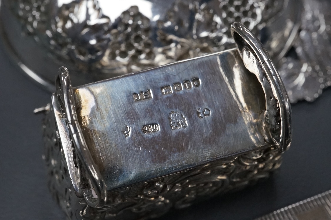 A small group of collectable silver including a Dutch miniature silver cradle box, import marks for London, 1898, 53mm, two other white metal miniature items including a chair, a continental 930 white metal taste vin, a